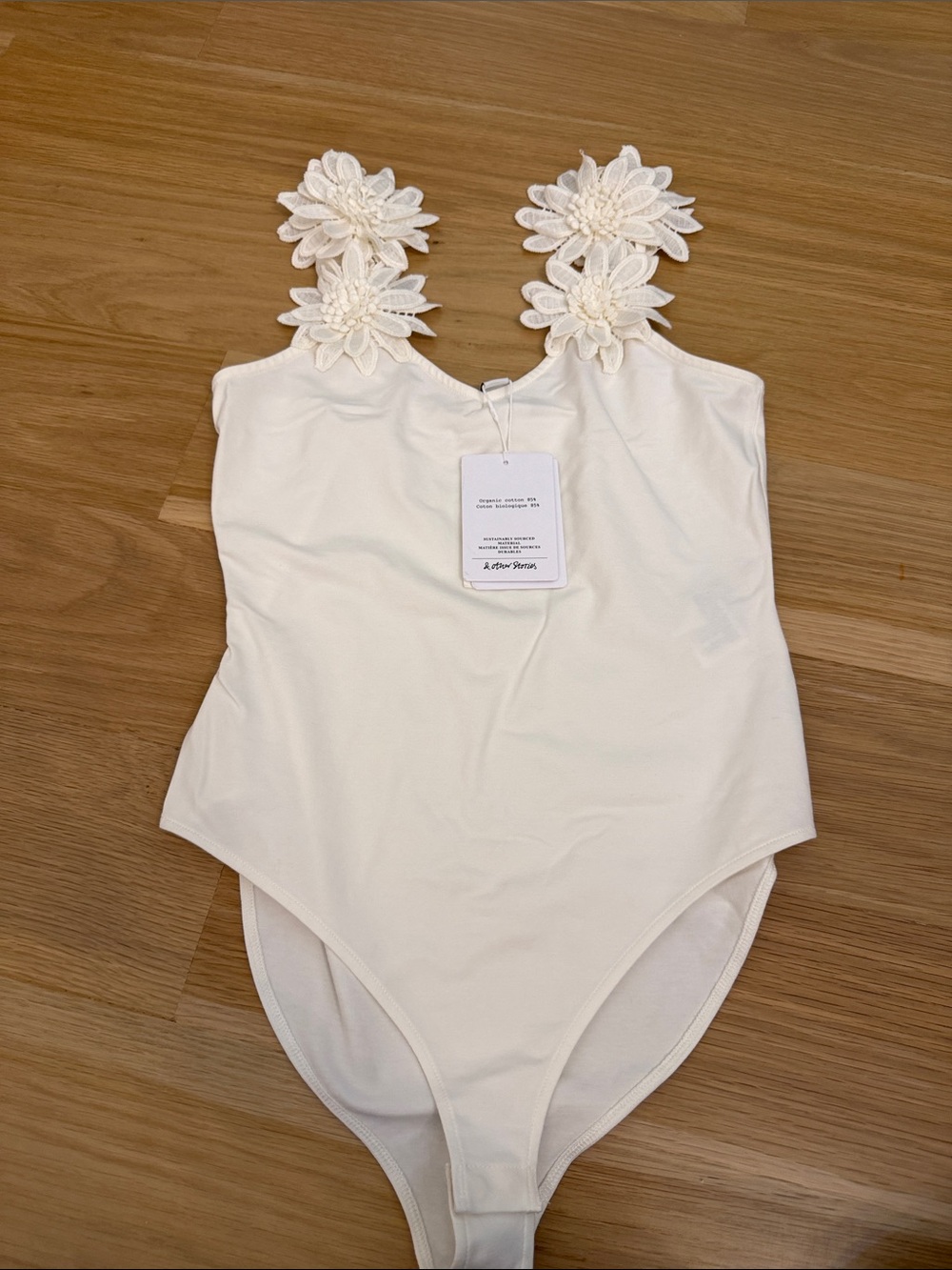 Floral-strap Cream Bodysuit with Decorative Appliqué Straps